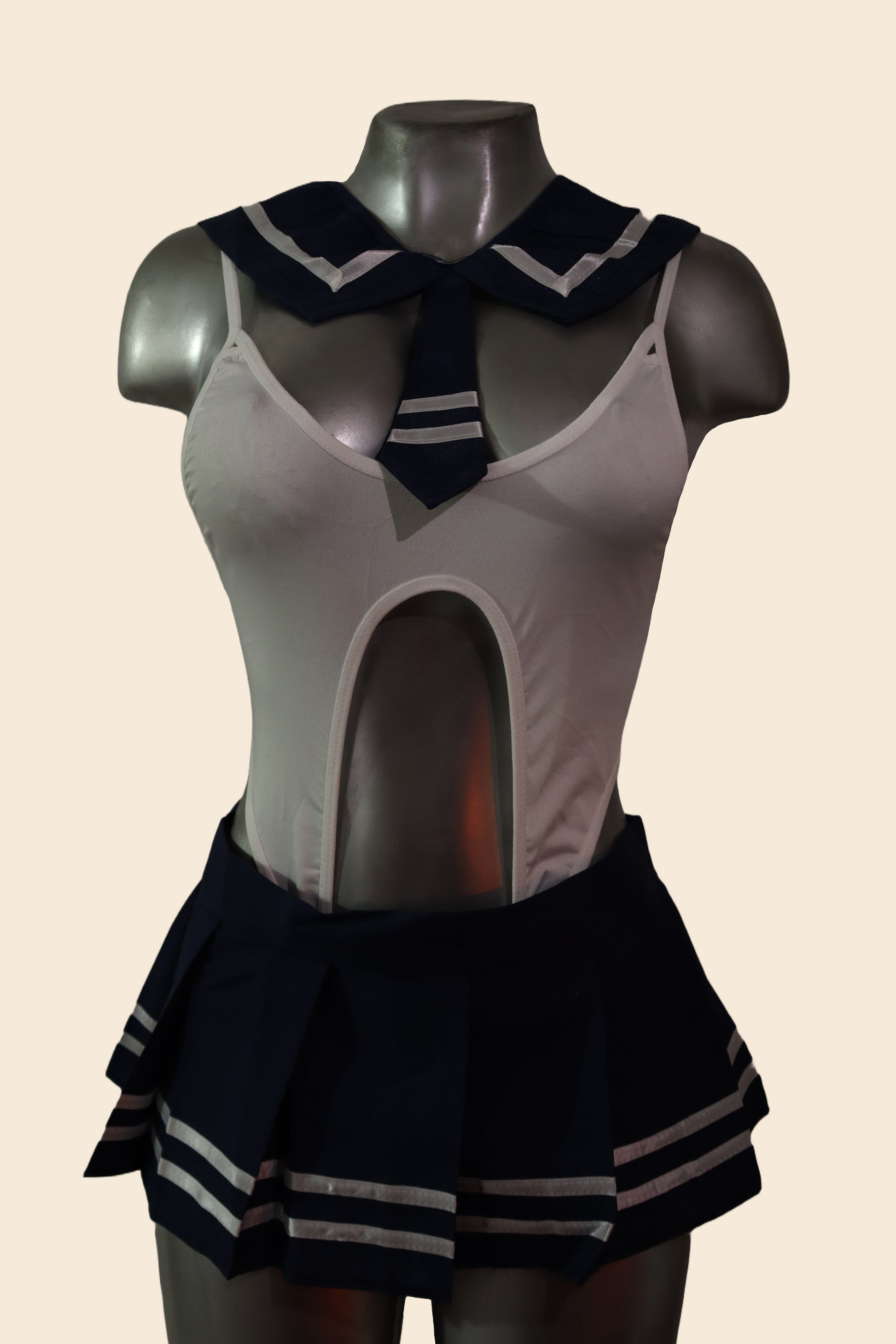 Disfraz de colegiala tipo lencería con falda plisada y cuello marinero, blanco y azul, vista frontal - Lunatik