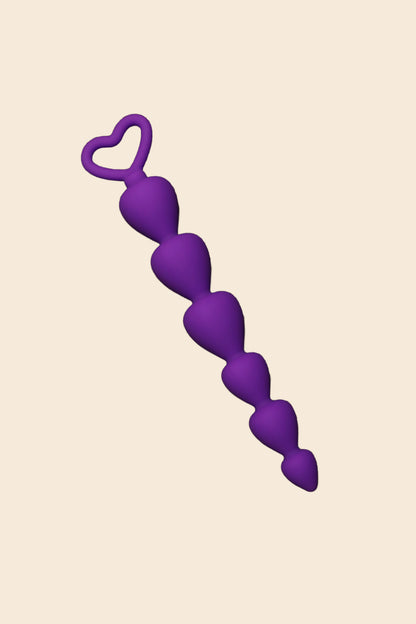 Plug anal de silicona con asa color morado diseño progresivo - Lunatik